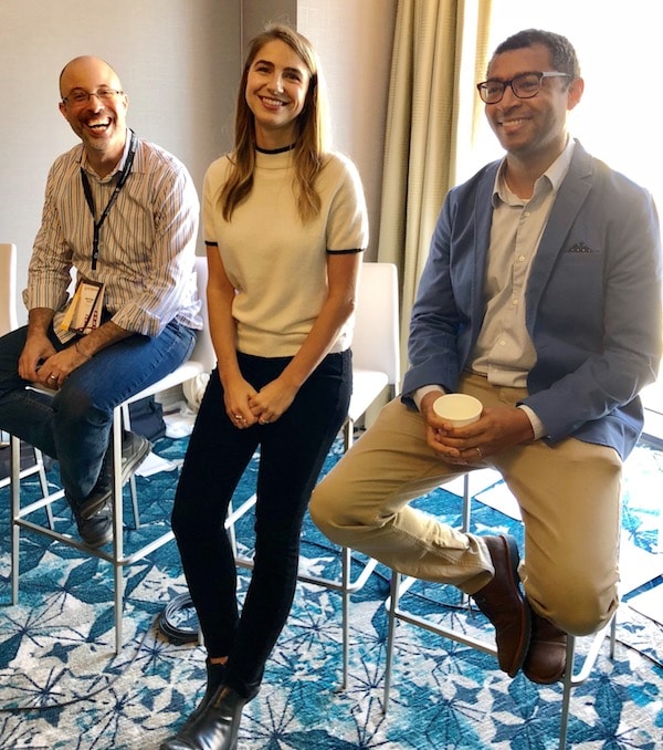 happy panelists smiling after a presentation